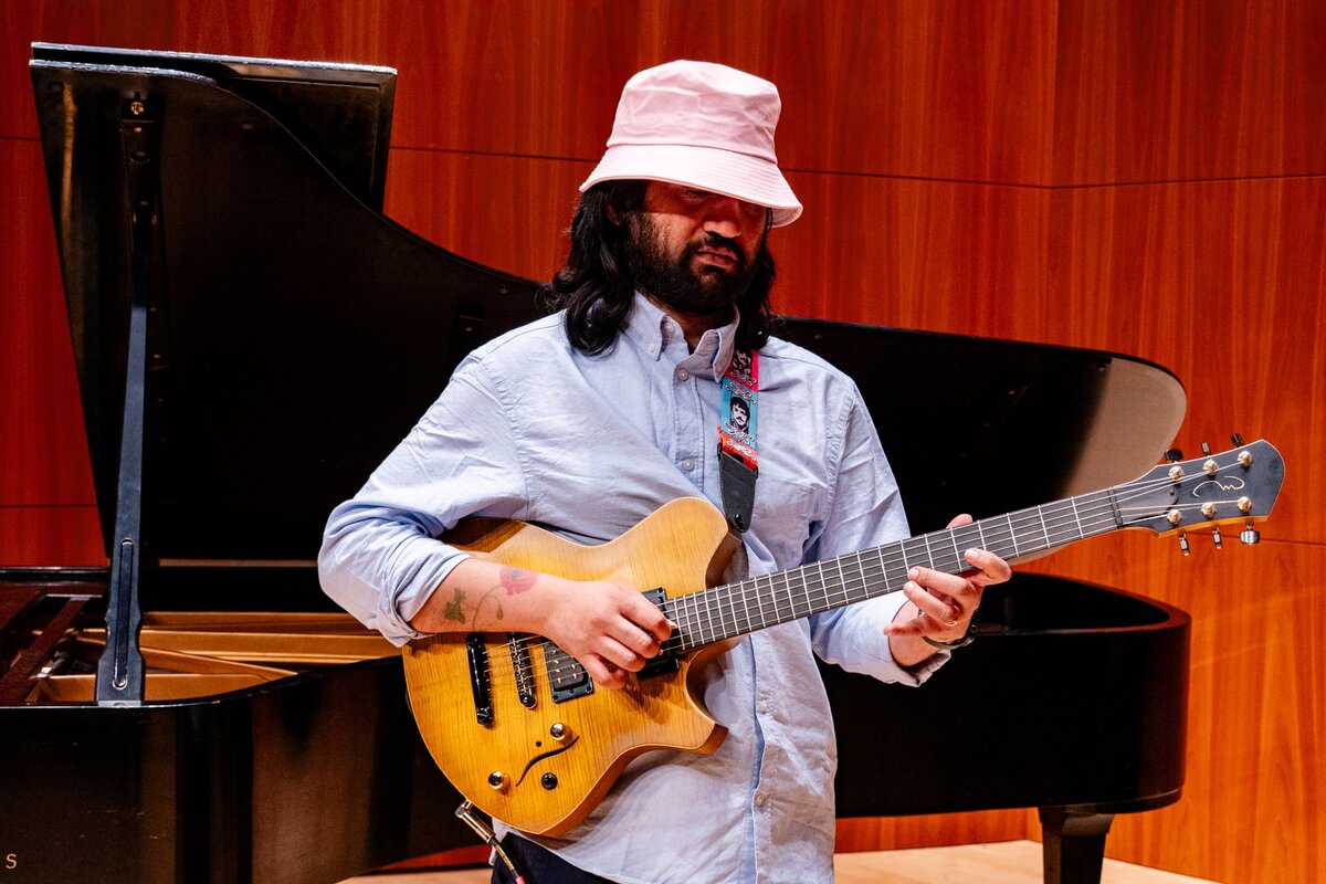 Eshaan wearing a hat, looking thoughtful